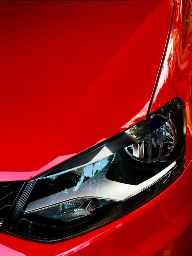 a close up of the front of a red car